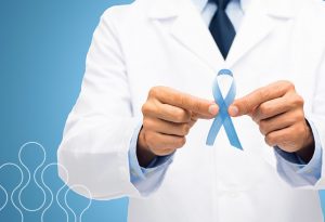 A man holding a blue ribbon to represent prostate cancer awareness