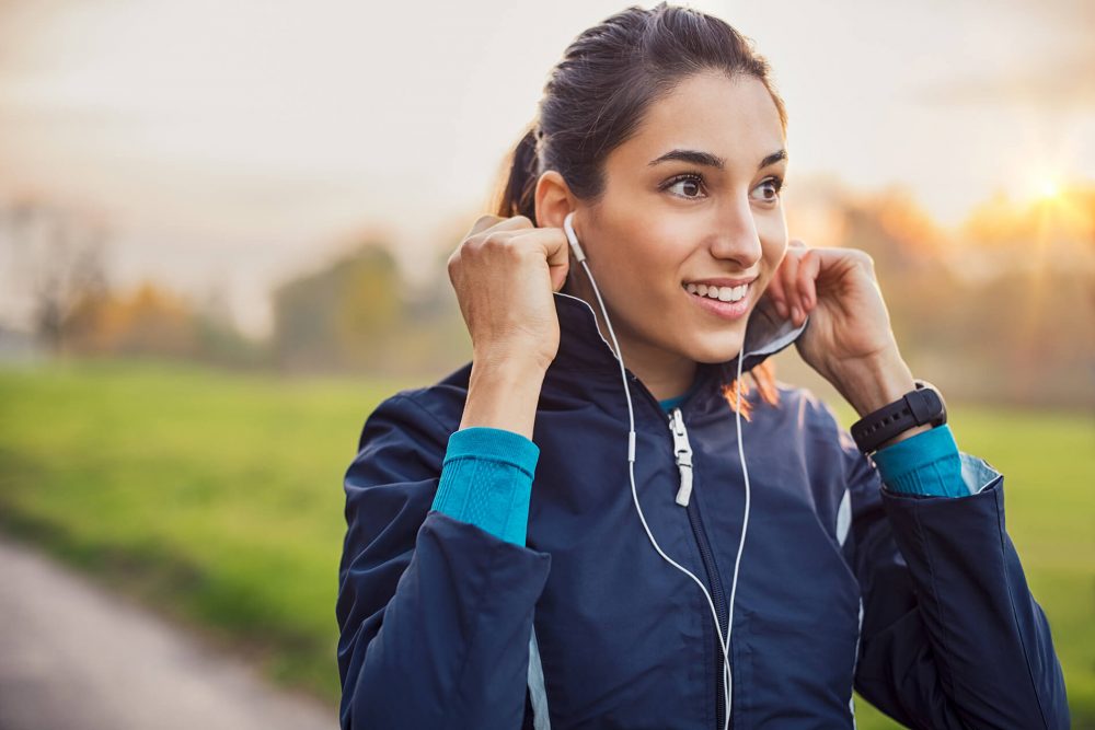 an image of a woman in workout gear outdoors